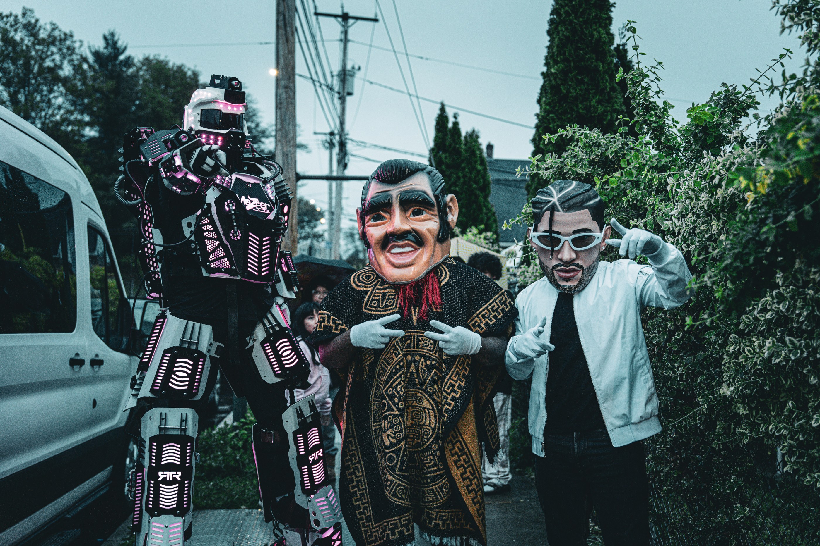 Costumed performers at a block party, photographed by La Camera